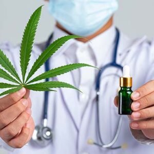 medical-doctor-holding-cannabis-leaf-bottle-cannabis-oil-white-wall